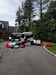 IMG 6897 1774977183 TODDLER RACERS AND PIT STOP BOUNCE HOUSE PACKAGE DEAL